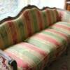 Antique reproduction sofa upholstered in striped damask.