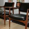 Mid-century modern chairs re-upholstered in leather.